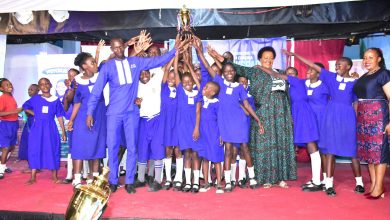 Nakivubo Primary School celebrates with their headteacher and the Director Education and Social Services KCCA on the extreme right.