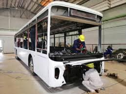 Workers building Kiira Motors’ Kayoola EVS bus